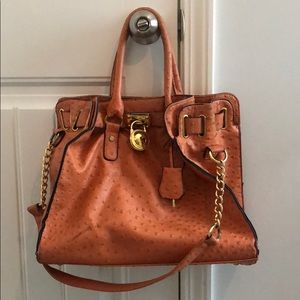 Michael Kors orange tote bag